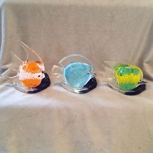 Three glass fish tea light holders.  Varying sizes